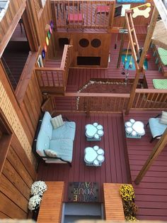 an overhead view of a living room and patio area in a dollhouse with furniture