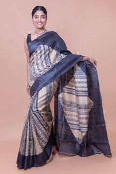 This saree has a tribal inspired motif. It has a bold and original color. We've used tribal patterns in the saree to give a modern look. Our designers didn't compromise with the genuineness of the colors. It is an ideal formal wear. This minimalistic yet original and is ideal for those women who hold a commendable place in society or at work. This handwoven tussar silk saree is the ideal saree to have in your collection. The presence of tussar silk makes this saree incredibly soft and light. Hen Office Wear Saree, Saree In Black, Khadi Saree, Silk Saree With Blouse, Tussar Silk Saree, Silk Sarees Online, Saree Online, Saree Look, Saree With Blouse