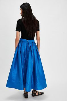 A true party staple, this special stunning skirt will turn heads with every wear. **Fit:** High-rise, full A-line silhouette **Features:** Sheen finish, pleating at top, finished hem, invisible zip closure, poplin fabrication **Why We ❤ It:** An essential piece to dress up or down, pair this with a silky cami or chunky sweater for endless ways to wear. | Emilia Full Skirt by Free People in Blue, Size: M Lake Victoria, Maxi Skirt Style, Maxi Jumpsuit, Playsuit Dress, High Risk, Outerwear Vest, Invisible Zip, Dress Gift, Chunky Sweater