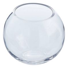 a clear glass vase sitting on top of a white table