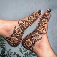 the feet are decorated with henna and flowers