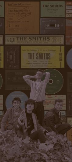 the smiths are posing for a photo in front of some old record labels and cds