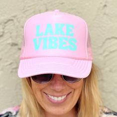 Lake Vibes Pink Trucker hat with blue font. Adjustable back strap and french terry head band. Lake Trucker Hat, Lake Shirts, Lake Vibes, Pink Trucker Hat, Trending Hats, Blue Font, Pink Lake, Yellow Glitter, Hanging With Friends