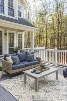 a couch and coffee table on a porch