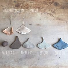 five different types of earrings hanging from hooks on a wooden surface with text that reads ginko leaf paper template, wet clay, bone dry, cone