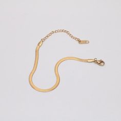 Minimal and classic, our Greta Bracelet is made of high quality herringbone chain. The Greta... Gold Metal Snake Chain Bracelet, Metal Gold Snake Chain Bracelet, Modern Gold Bracelet In Snake Chain Style, Everyday Gold Herringbone Necklace, Gold Herringbone Necklace For Everyday Wear, Gold Minimalist Herringbone Necklace, Minimalist Gold Stainless Steel Chain Bracelet, Minimalist Snake Chain Bracelet With Lobster Clasp, Minimalist Metal Snake Chain Bracelet