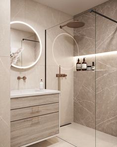 a bathroom with a sink, mirror and shower stall in it's center area