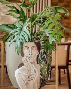 a potted plant sitting on top of a wooden table