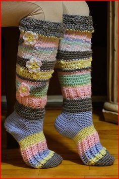 there is a woman's legs wearing crocheted socks and boots with flowers on them