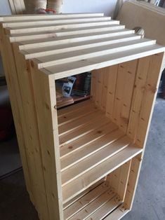 a wooden shelf sitting on top of a hard wood floor