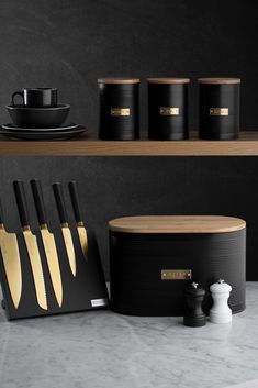 black and gold kitchen utensils on shelves