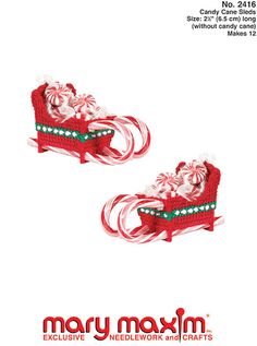 two red and white christmas sleighs with candy canes on them, next to each other