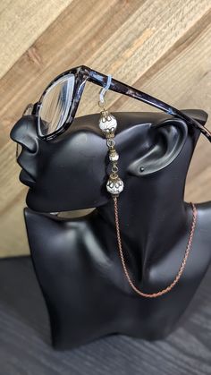 Bronze Glasses Chain with black and white splatter beading. Glasses Chains, Glasses Chain, Eye Wear Glasses, Eyewear Sunglasses, Sunglasses Accessories, Beading, Bathing Beauties, Accessory Gift, Gift Card