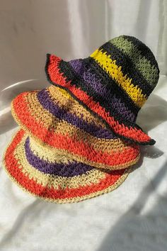 Packable crochet straw bucket hat with multi color stripes. Also comes with a size adjuster inside. Made of 100% straw. Can be folded very small to fit in your purse. Made In: China Spring Straw Bucket Hat, Vacation Bucket Hat With Woven Detail, Woven Summer Bucket Hat, Spring Bucket Straw Hat, Summer Bucket Hat In Straw, Casual Straw Bucket Sun Hat, Woven Bucket Hats For Summer, Casual Summer Straw Bucket Hat, Bohemian Multicolor Cotton Yarn Sun Hat