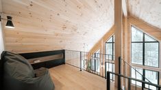 a loft with wooden walls and flooring