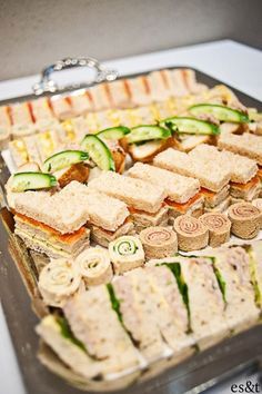 a bunch of sandwiches and crackers on a table