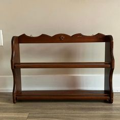 a wooden shelf sitting on top of a hard wood floor