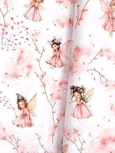 a pink and white wallpaper with little fairy dolls on it's back side