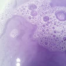 the bubbles in the water are purple and white