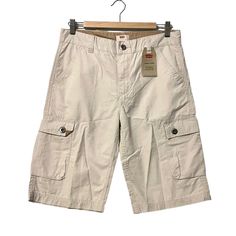 Levi's Cargo Shorts Falls Below Knee Cream Youth Size 18 Regular 29 Waist New With Tags Extra Room In Seat And Thigh 2 Side Pockets 2 Cargo Pocket With Button Close 2 Back Pockets With Button Close Normcore Casual 100% Cottom Comfortable Breathable Material Made In Vietnam 0390 Cargo Pants Youth, Low Rise Cargo Shorts, Cheap Cargo Shorts, Where To Get Cargo Shorts, Spring Bermuda Cotton Cargo Pants, Short Cotton Cargo Pants For Spring, Beige Cargo Shorts, Levi's Beige Bottoms For Spring, Levi's Casual Shorts With Pockets