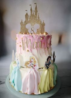 there is a cake decorated with princesses on it