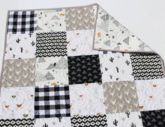 two black and white quilts laying on top of each other in the same pattern