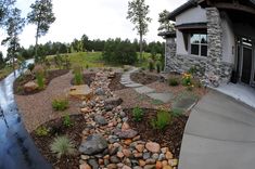 a house with rocks and gravel in front of it