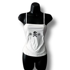 White square neck cami with a black skull and crossbones design. 67% Polyester, 30% Viscose, 3% Elastane, slight stretch. Size up if bust if larger than a B cup. Please handwash this item or machine-wash cold and let it air dry. Heat can alter the design. All items are made to order and can take up to 14 days to make and ship out. The current USPS standard arrival time is 5-8 business days. The current USPS priority arrival time is 1-4 business days. The Christmas delivery cutoff date was Dec. 4 Y2k Skull Print Tops For Alternative Fashion, Gothic Tank Top For Night Out, Y2k Style Tank Top For Club, Fitted Sleeveless Top With Skull Print, Y2k Spaghetti Strap Club Tops, Y2k Spaghetti Strap Tops For Club, Gothic Streetwear Tops For Summer, Gothic Tank Top For Streetwear, Y2k Tank Top For Alternative Fashion