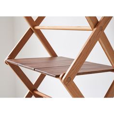 a wooden shelf with two shelves attached to it