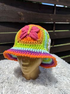 a crocheted hat on top of a mannequin head