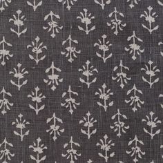 an old black and white fabric with small flowers on the front, in various sizes