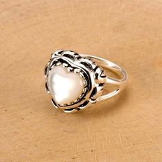 Captivating Ring Fashioned With Mother-Of-Pearl Set In Lustrous Sterling Silver Face: 16.5 Mm W X 15.9 Mm H Sterling Silver / Mother-Of-Pearl Elegant White Rings For Mother's Day, White Heart Ring For Gift, White Heart Ring For Mother's Day, Elegant White Open Heart Ring, White Heart Cut Ring For Mother's Day, White Heart Cut Heart Ring For Mother's Day, White Heart-shaped Rings For Valentine's Day, White Rings For Valentine's Day, Adjustable White Heart Ring For Wedding