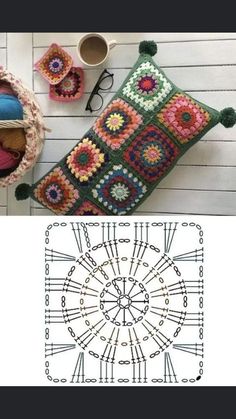 a crocheted pillow and some other items on a table next to a coffee cup