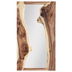 a mirror made out of wood that has been cut in half to look like an animal's head