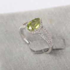 ~~~~~~~~~~~~~~~~Ring details~~~~~~~~~~~~~~~~metal: silver/14k white(rose/yellow) goldcenter stone: pear shape 6*9mm (1.51ct) real peridot accent stone: czNOTE: if it is silver or white gold, it will be get plated with rhodium~~~~~~~~~~~~~~~~Customization is available~~~~~~~~~~~~~~~~you can change, add or remove any parts of the ring if you have good idea. I can add special engraving inside the shank of the ring by free (words, date, simply simbles and so on) too. I am happy to help out or make a Pear-shaped Birthstone Promise Ring, White Gold Sterling Silver Pear-shaped Ring, Pear-shaped White Gold Sterling Silver Ring, Pear Shaped White Gold Sterling Silver Rings, Green Pear-shaped Promise Ring, Sterling Silver Solitaire Pear Rings, Green Diamond Pear-shaped Ring, Teardrop Peridot Jewelry For Anniversary, Green Teardrop Diamond Ring