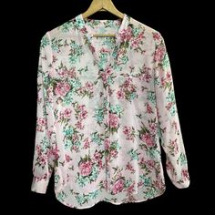 This Is A Super-Feminine Semi-Sheer Floral Button-Down Blouse With V Neck And Roll Tab Sleeves. There Are No Tags But Blouse Appears To Be Unworn. **See All Photos For Overall Condition, Style, Colors And Measurements ** Pink Floral Print Blouse With Split Neck, Pink Floral Print Split Neck Blouse, Summer Split Neck Pink Blouse, Pink Split Neck Blouse With Floral Print, Casual Pink Blouse With Split Neck, Feminine Pink V-neck Blouse, Feminine Pink Button-up Blouse, Pink Floral Print Button-up Blouse, Pink Floral Print V-neck Blouse