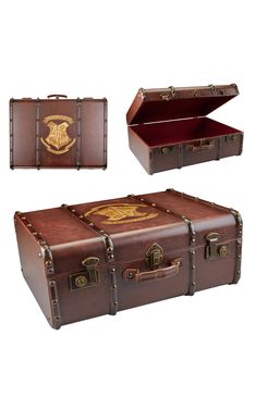 two pieces of brown leather luggage with harry potter emblem on the lid and one piece is open