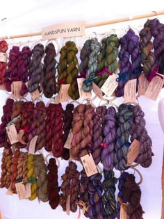 several skeins of yarn are on display for sale