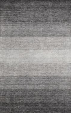 an area rug with grey and white stripes