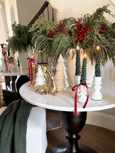 christmas decorations on a table in a living room