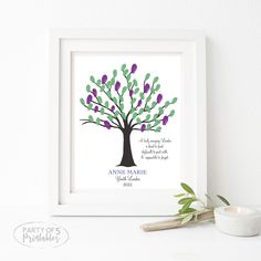 a family tree with purple, green and blue leaves is displayed in a white frame