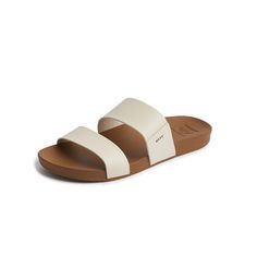 PRICES MAY VARY. Upper | Super soft unlined PVC Free vegan leather two strap slide Footbed | Our most comfortable footbed yet featuring the perfect blend of cushion and rebound support. This is a wider shape with generous arch support and heel cupping Outsole | Lightweight and durable rubber sponge outsole Everyday Leather Cushioned Footbed Sandals, Leather Cushioned Slide Flip Flops, Leather Slide Sport Sandals With Cushioned Footbed, Comfortable Leather Slides For Beach, Brown Cushioned Slide Footbed Sandals, Reef Sandals, Fashion Slides, Slides Women, Footbed Sandals