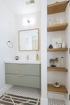 the bathroom is clean and ready to be used as a storage area for towels or other items