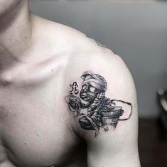 a man with a tattoo on his chest