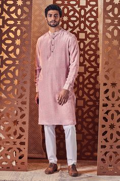 Pink kurta with geometric print and mandarin collar. Paired with pant.
Component: 2
Pattern: Printed
Type Of Work: Geometric
Neckline: Mandarin
Sleeve Type: Cuff Sleeves
Fabric: Kurta: Crepe, Lining: Cotton, Pant: Poplin
Color: Pink
Other Details: 
Front buttons
Printed kurta
Occasion: Puja - Aza Fashions Blouse Yoke, Pink Kurta, Kurta With Pants, Pernia Pop Up Shop, Edgy Look, Kurta Set, Cotton Pants, Set Design, Mandarin Collar