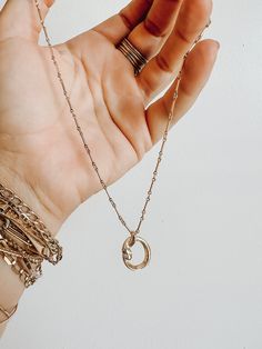 This handmade snake charm wrapped into a circle is a new favorite! shown in the photos on the bar chain, or available on a simple rolo chain as well. Mini clear cz stones as the eyes 14k gold filled chain. Snake Circle, Circle Necklace, Rolo Chain, A Circle, Gold Filled Chain, Cz Stone, Bar Necklace, The Bar, Chain Styles