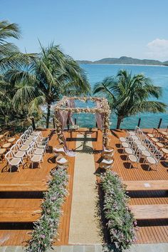 an outdoor wedding setup with chairs and flowers