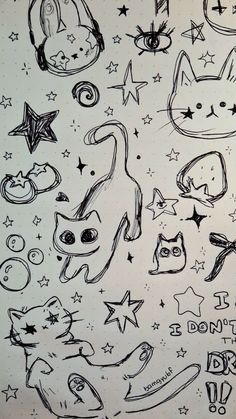 a drawing of cats and stars on a sheet of paper