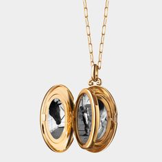 Monica Rich Kosann locket necklace. 18-karat yellow gold. Oval locket with pav diamond border. 0.336 total diamond carat weight. Locket opens to display four photos. Chain, approx. 30"L. Pendant drop, approx. 1.3"L. Lobster clasp. Imported. Luxury Yellow Gold Oval Locket Necklace, Luxury Keepsake Medallion Necklace, Luxury Locket Necklace, Luxury Medallion Locket Necklace, Luxury Medallion Locket Necklace For Formal Occasions, Luxury Medallion Locket Necklace As Gift, Luxury Medallion Locket Necklace For Gift, Luxury Medallion Locket Necklace Gift, Luxury Polished Pendant Locket Necklace