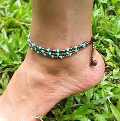 Hand Made Fair Trade Anklet Three Strand Brass Turquoise Adjustable 2 sizes Hand Made Anklets From Thailand Bohemian Turquoise Anklets For Festivals, Bohemian Beaded Ankle Wrap Jewelry, Turquoise Beaded Festival Anklets, Nickel-free Turquoise Beaded Bracelets For Festivals, Bohemian Gold Beads Anklets For Summer, Bohemian Jewelry In Turquoise Waxed Cord, Bohemian Jewelry In Turquoise With Waxed Cord, Bohemian Turquoise Jewelry On Waxed Cord, Bohemian Turquoise Jewelry With Waxed Cord